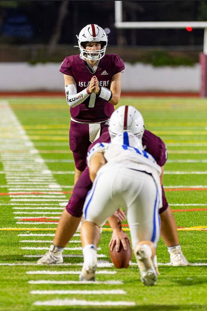 Mercer Island High School senior quarterback Spencer Kornblum takes a snap during the Islanders’ contest with Seattle Prep on Sept. 1. Photo courtesy of Linda Kercher