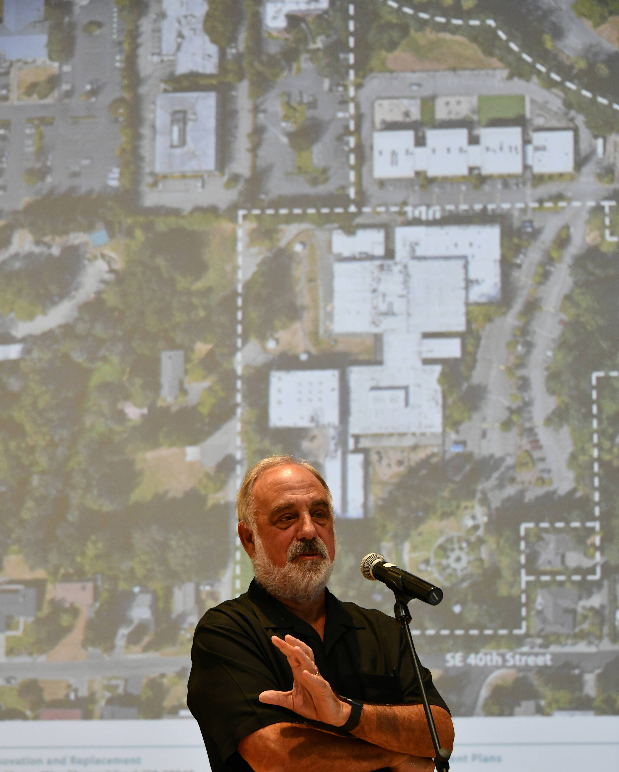 Architect Ed Weinstein rolls through the proposed renovation project presentation at the Stroum Jewish Community Center on Sept. 7. Andy Nystrom/ staff photo