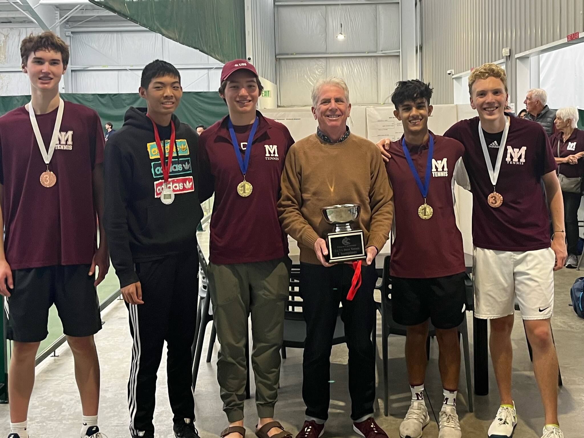 The Mercer Island High School (MIHS) boys varsity tennis team successfully defended its 3A KingCo title with a 13-0 season record and won the recent KingCo tournament. Advancing to the district tournament in the spring are the top three doubles teams from the tournament, all from MIHS: First place, Gian Manhas/Nathan Wen; second place, Connor Leung/Sam Dilworth; and third place, Logan Herzinger/Charlie May. Pictured from left to right are: May, Leung, Wen, coach Ron Akins, Manhas and Herzinger. (Not pictured, Dilworth.) Leung and Dilworth have both committed to play college tennis next season. Leung will attend Emerson College in Boston and plans to major in media arts production; Dilworth will play for Colorado College and plans to study business. Both are pictured below, left to right. Courtesy photos