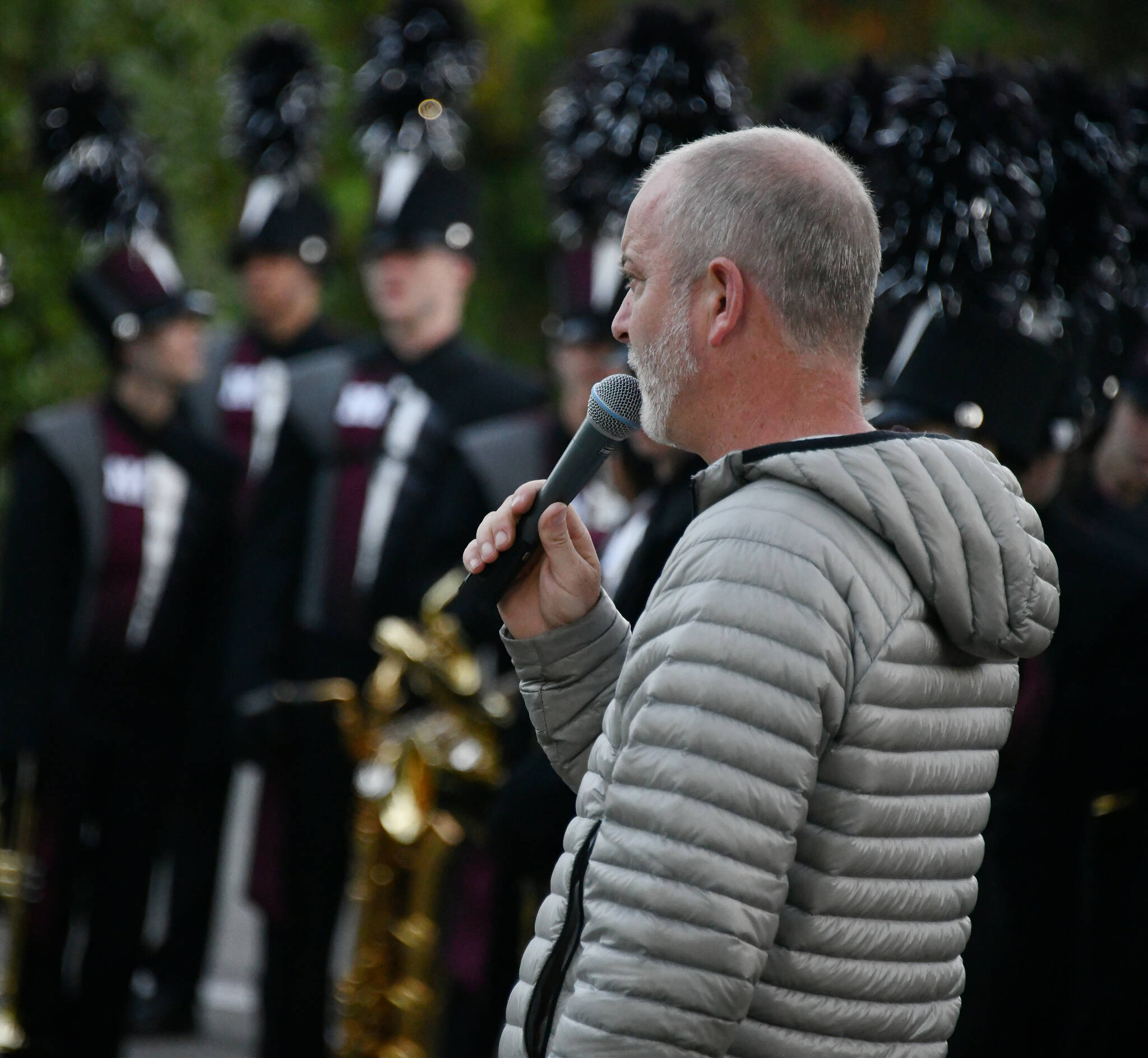 Parker Bixby, who is one of three band directors along with Jacob Krieger and Kyle Thompson, communicates with the Mercer Island High School marching band during a full dress rehearsal on Oct. 12. Andy Nystrom/ staff photo
