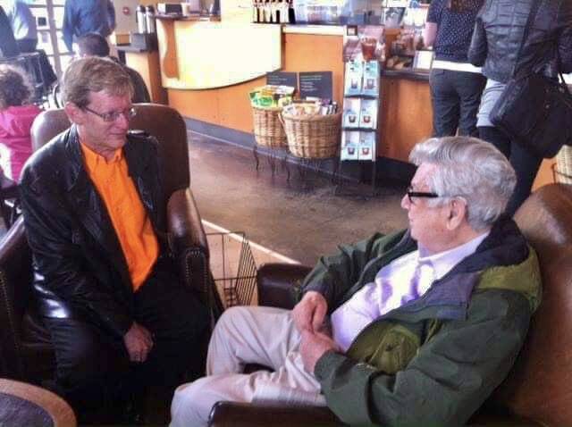 Abraham Kaplan (right) visits with organist Mark Thallander in the Mercer Island Starbucks. (Courtesy photo)