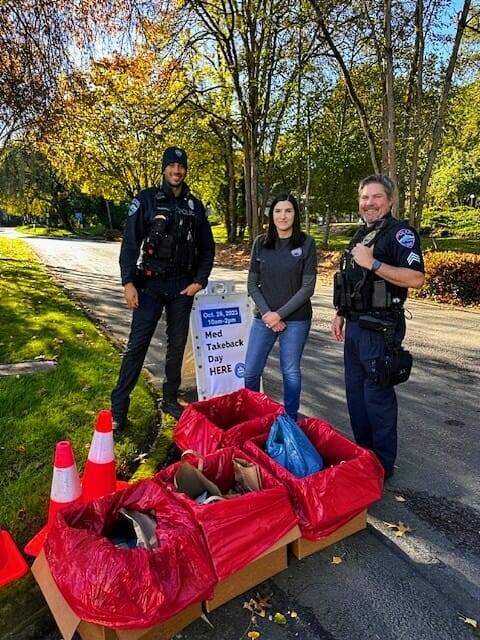 From left to right, Mercer Island Police Department officer Ty McDowell, a Drug Enforcement Administration representative and Mercer Island Police Department Sgt. George Schmalhoffer. Photo courtesy of the Mercer Island Police Department