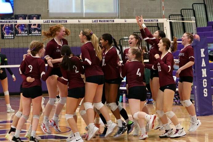 Mercer Island High School’s volleyball team is overcome with joy at the 3A SeaKing District Tournament. The girls qualified for state at the event. Photo courtesy of Amy Hopkins
