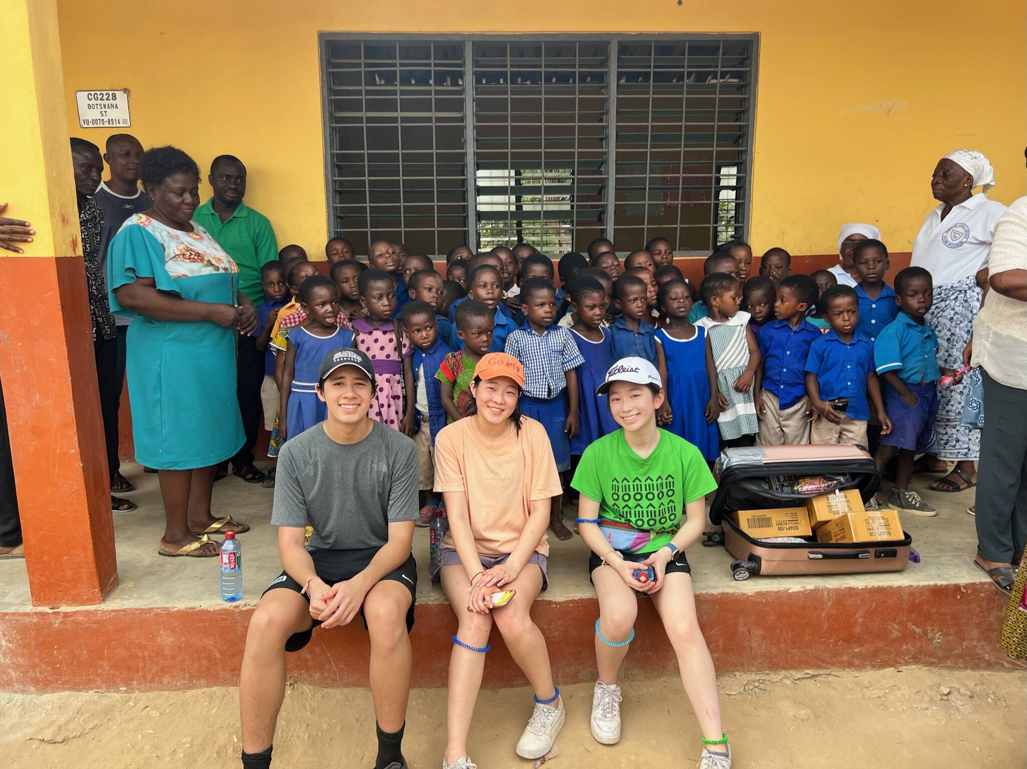 Front, from left to right, Mercer Island’s Zach Said, Mia Han and Islander Chloe Yang gather with students and other residents of Ghana’s Sokpoe village in February of 2023. Courtesy photo