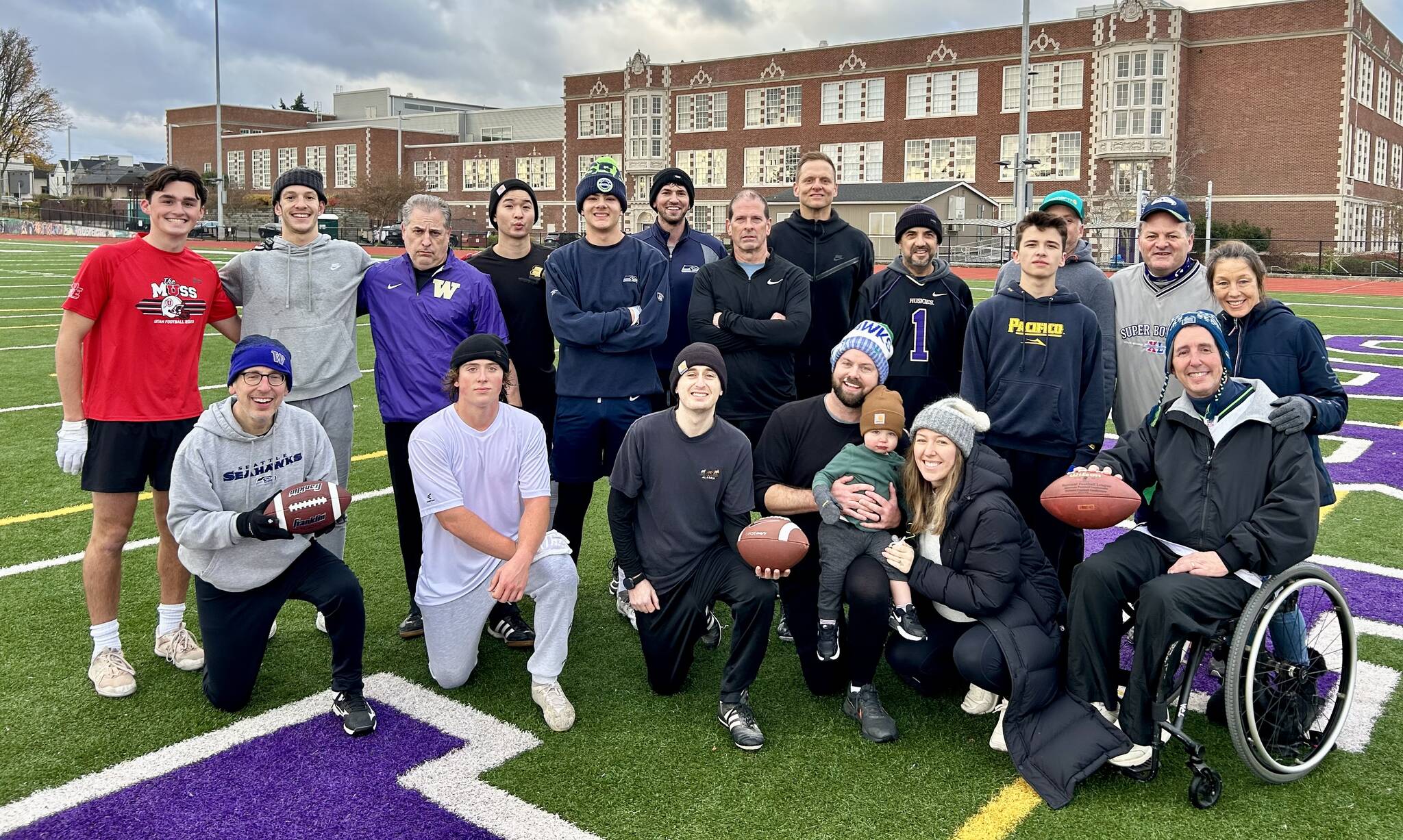 About 10 Mercer Island current or past residents participated in the 36th annual Turkey Bowl on Thanksgiving Day at Garfield High School. The core group of players includes Michael Schiller, Curtis Knopf, Rich Strauss, Matt Turetsky and David Schiller. This year, Michael’s 18-month-old grandson Jaylan was a participant and is included in this photo with his parents and Island residents Karli and Josh Niehaus. Photo courtesy of Mia Blake