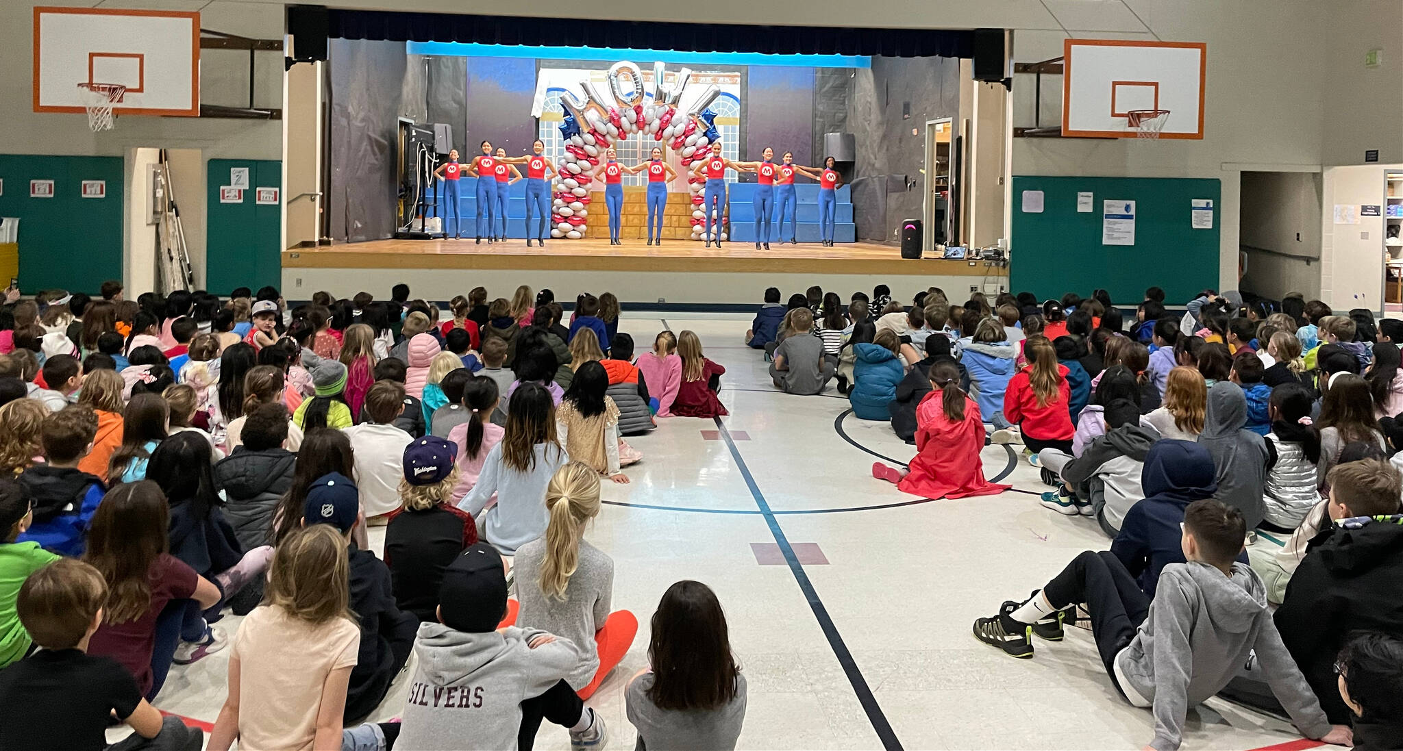 The Mercer Island High School drill team performs at West Mercer Elementary School on Dec. 6. Photo courtesy of the Mercer Island School District