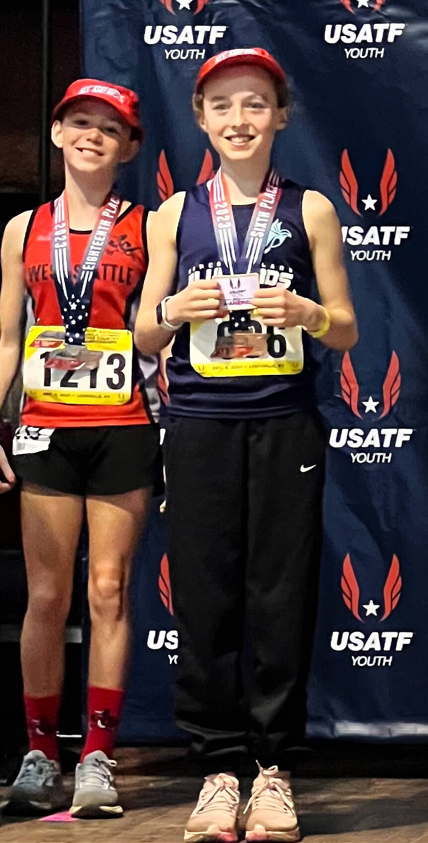 West Mercer Elementary School students Savannah Brondstetter, left, and Beau Berry, right, competed in the USATF Junior Olympic National Cross Country championship on Dec. 9 at Tom Sawyer State Park in Louisville, Kentucky. They notched All- American Cross Country honors as Berry placed sixth and Brondstetter placed 18th in the women’s 3,000-meter age 9-10 race. Mercer Island Bluebirds runner Berry finished in 11:18.44, and West Seattle Road Runners harrier Brondstetter finished in 11:36.26. Courtesy photo