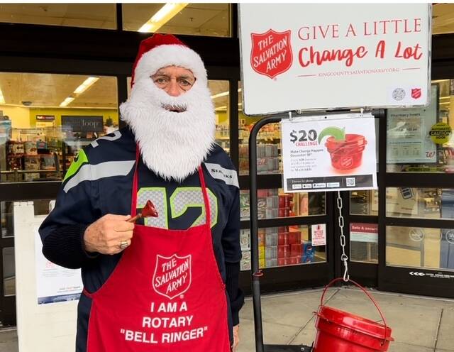 Rotary Club of Mercer Island members collected $1,158.55 from generous Islanders while bellringing for The Salvation Army on a recent Saturday at Walgreens and the north and south QFC markets. Pictured is Pastor Greg Asimakoupoulos, who attracted donors with his singing and his kindness at Walgreens, according to Rotary. Courtesy photo