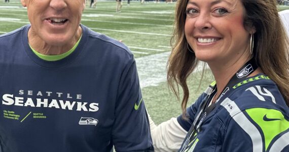 Greg’s daughter Kristin was photographed with Pete Carroll on her 40th birthday a recent home game. (Courtesy photo)