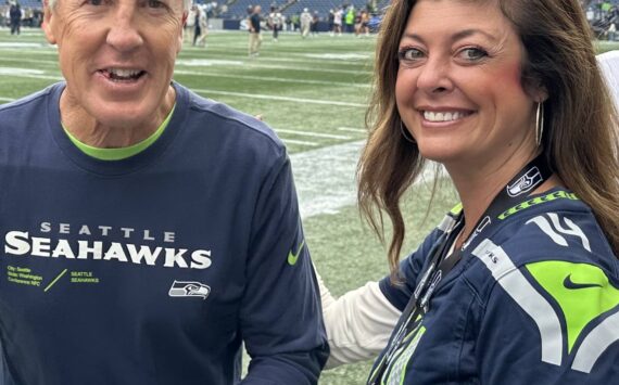 Greg’s daughter Kristin was photographed with Pete Carroll on her 40th birthday a recent home game. (Courtesy photo)