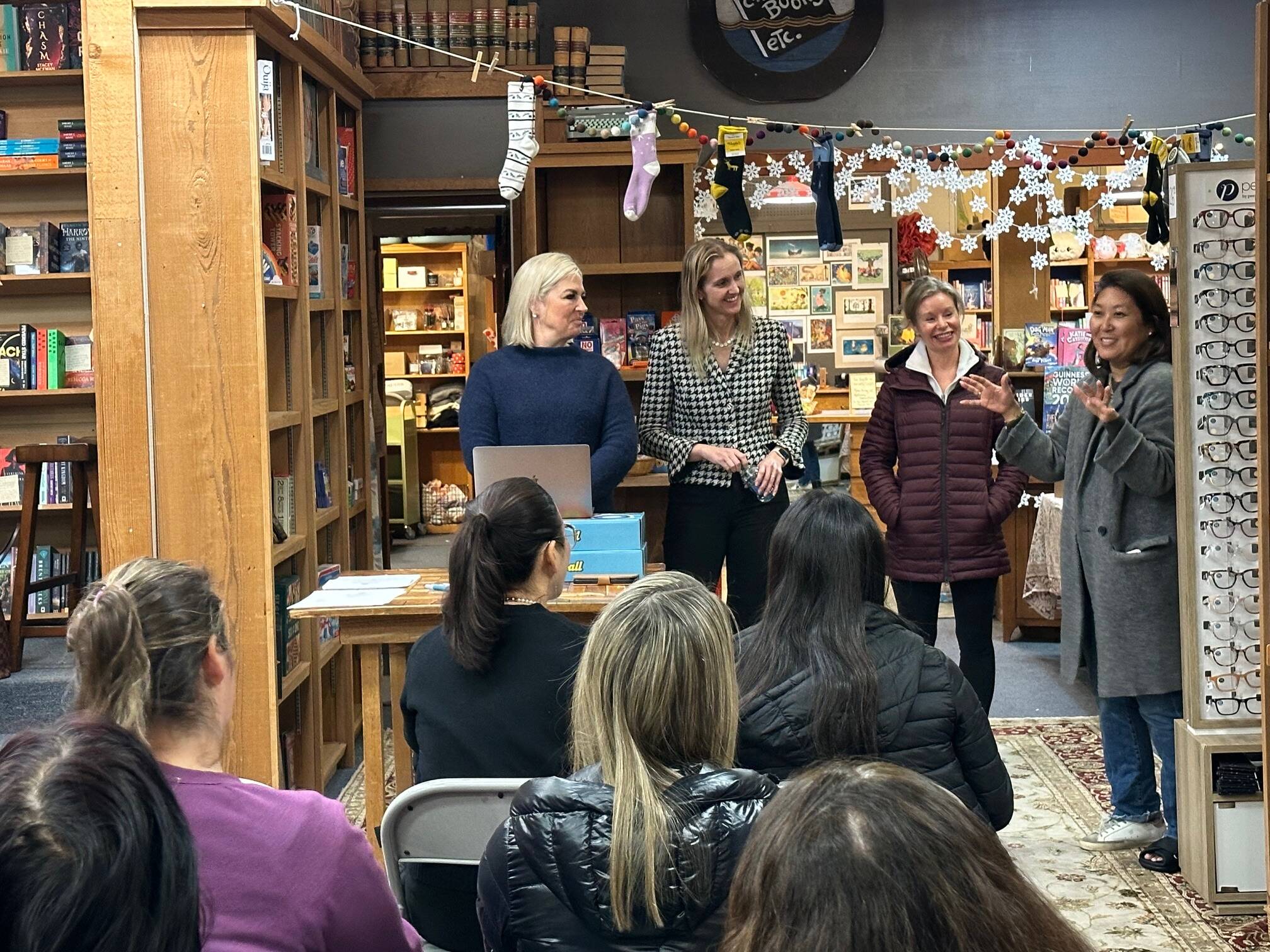From left, Mercer Islanders Robyn Baron, Stacey Thornton, Anna Becker and Robyn Kimura Hsu discuss the National Charity League on Jan. 16 at Island Books. Photo courtesy of Poppy MacDonald