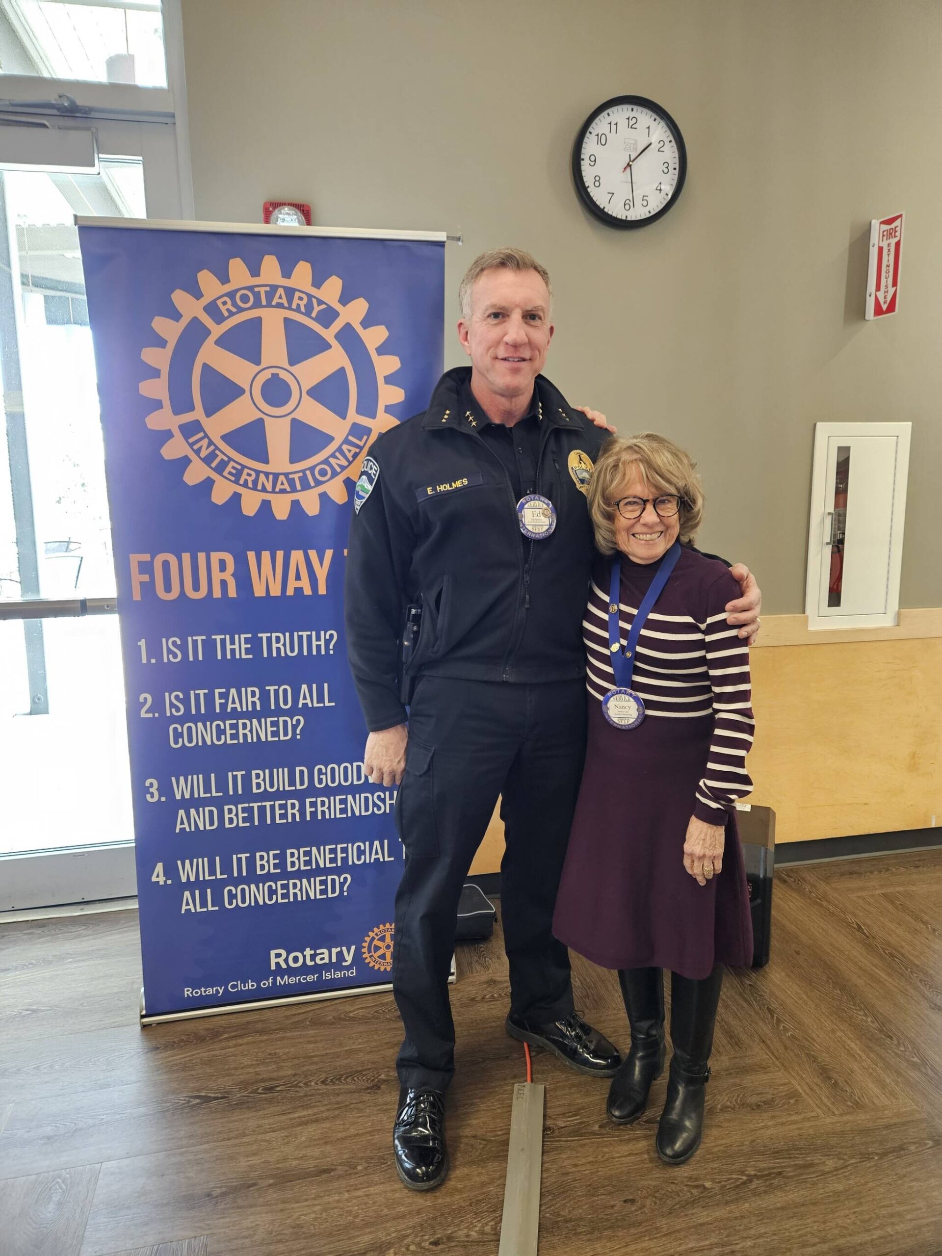 Photo courtesy of John Hamer
Mercer Island Police Chief Ed Holmes with Nancy Lee at a recent Mercer Island Rotary Club meeting.