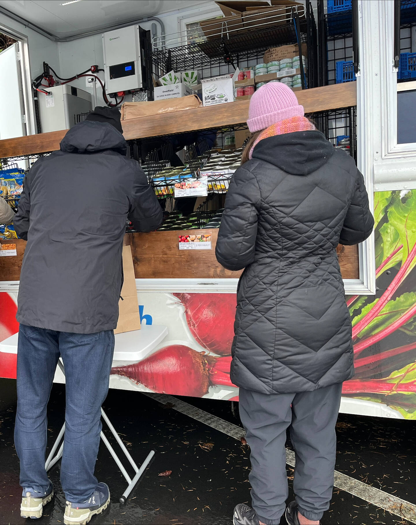 People shop at the Hopelink Mobile Market truck on Mercer Island during a recent visit to the community and event center. Photo courtesy of Mercer Island Youth and Family Services