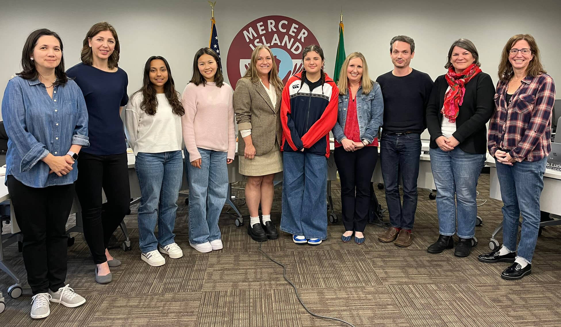 Islander Middle School eighth-grader Abigail Nissim (middle) is flanked by her language arts teacher Whitney Swope and school co-principal MaryJo Budzius as they join the school board directors at their March 14 meeting. Photo courtesy of the Mercer Island School District