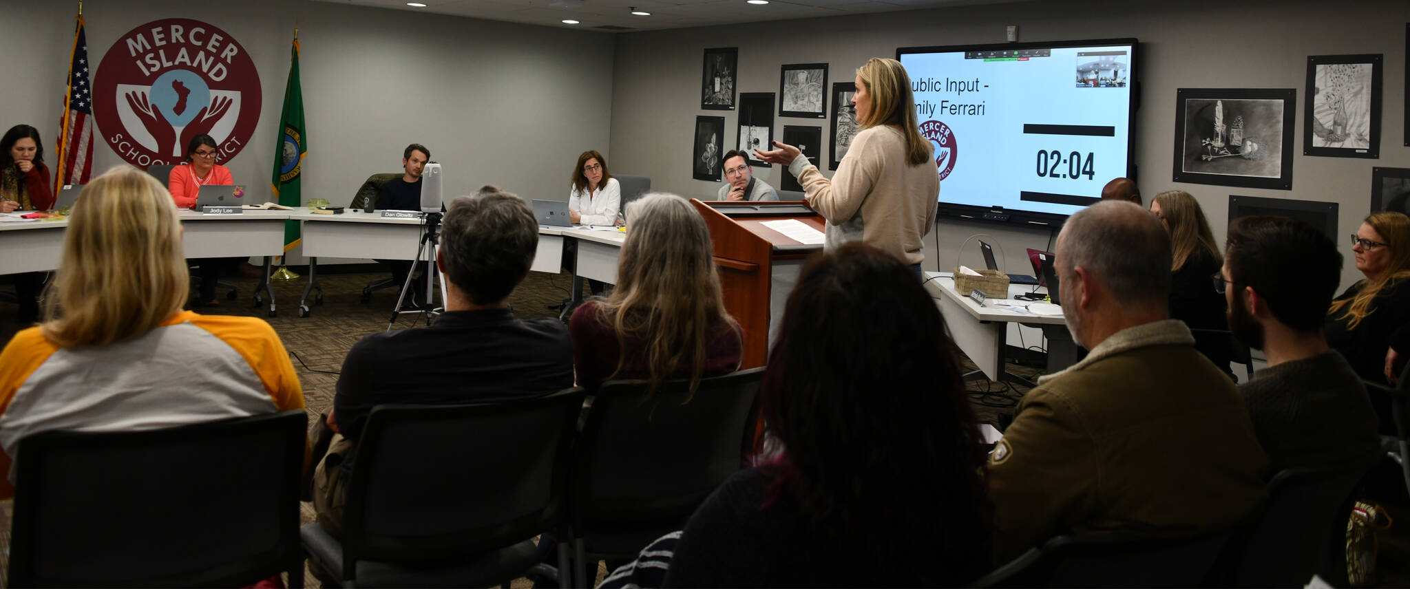 Mercer Island resident Emily Ferrari speaks in favor of open enrollment at the Mercer Island School District board of directors meeting on March 28. Andy Nystrom/staff photo