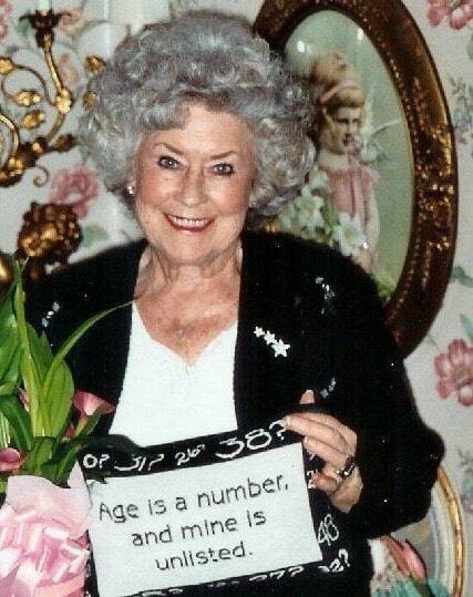 Greg’s late mother holding a pillow with her signature saying. Photo courtesy of Greg Asimakoupoulos