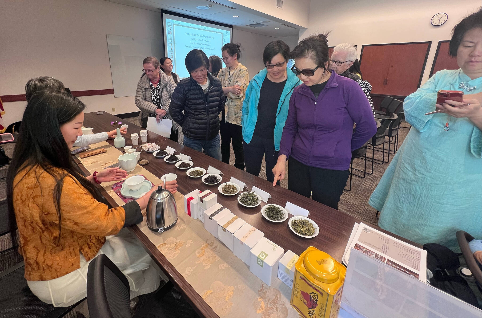 Attendees line up for a tea tasting at the Mercer Island Chinese Association event on April 17 at the Mercer Island Library. Photo courtesy of Fan Yuan