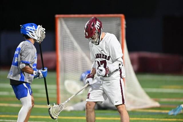 Mercer Island High School senior boys lacrosse captain Dylan Shobe clenches his fist after scoring a goal against Seattle Prep. Photo courtesy of Jim Jantos