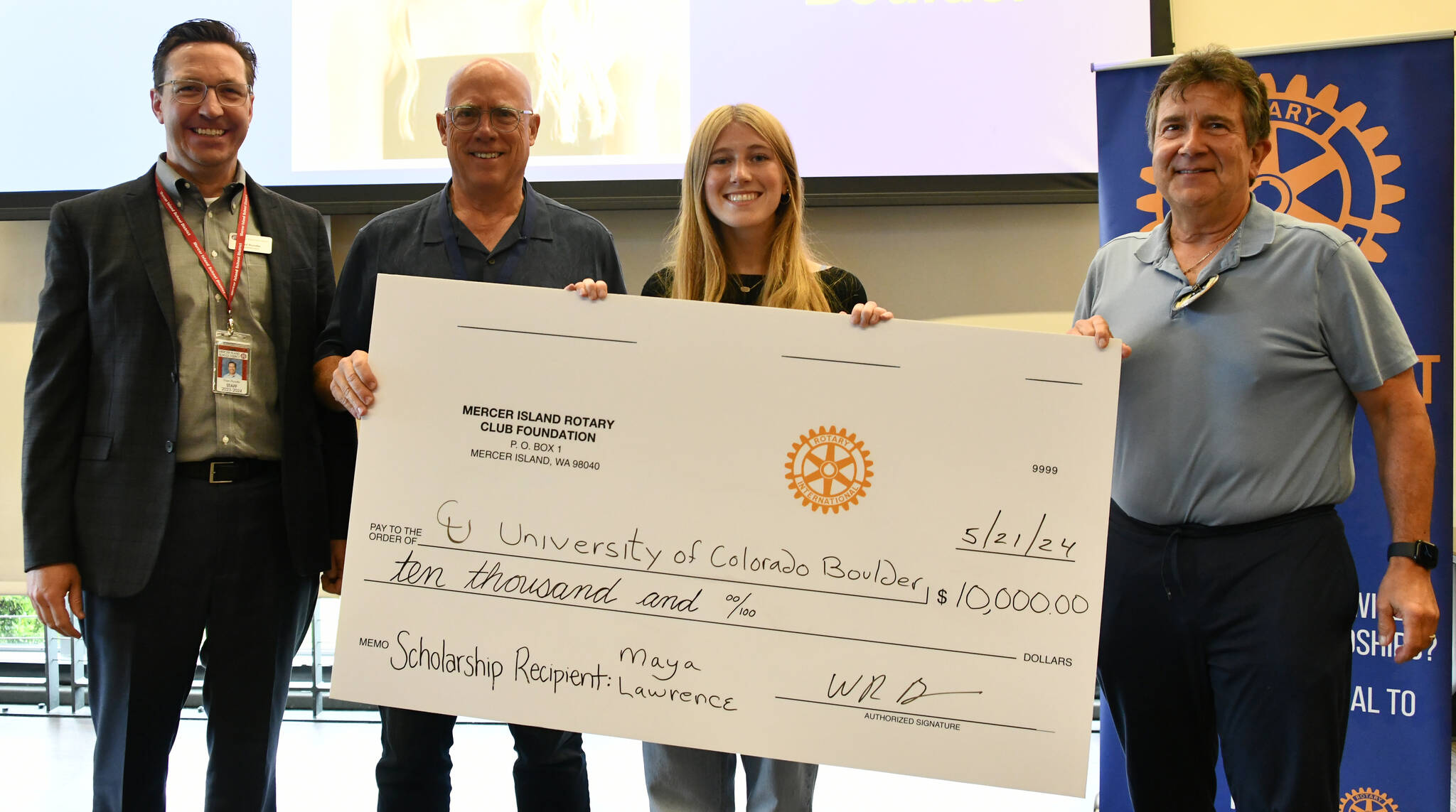The Mercer Island Rotary Club Foundation awarded its $10,000 scholarship to Mercer Island High School senior Maya Lawrence at Rotary’s May 21 meeting at the Mercer Island Community and Event Center. Pictured from left to right are, Mercer Island School District Superintendent Dr. Fred Rundle, chair of the scholarship committee Wally Boos, Lawrence and foundation treasurer and member of the scholarship committee Dave Thompson. Andy Nystrom/ staff photo