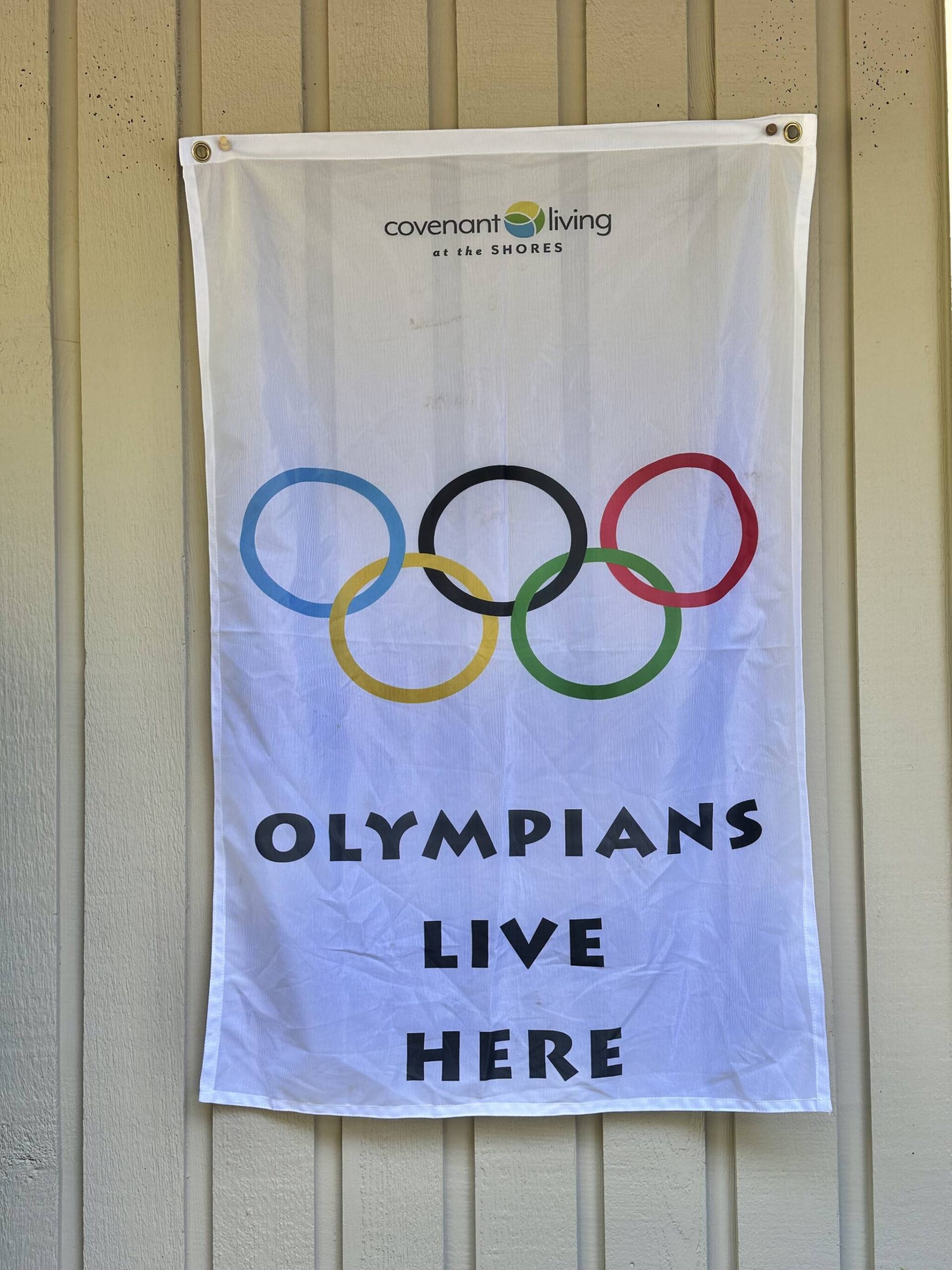 This banner outside Greg Asimakoupoulos’ home illustrates that a competitor in the Olympics of Life lives inside. Courtesy photo