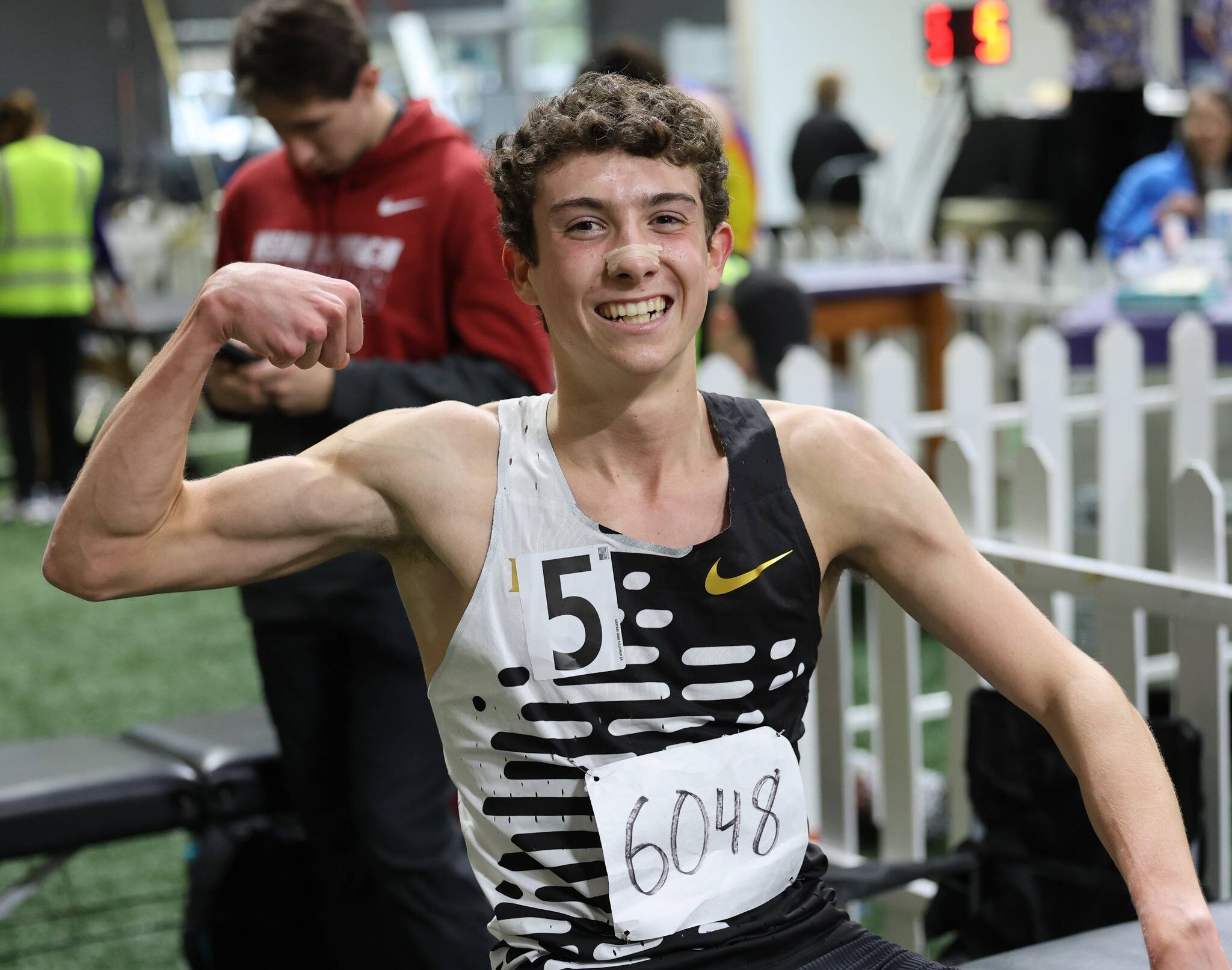 Mercer Island High School senior Owen Powell celebrates notching a sub-four minute mile on Feb. 15 at the University of Washington Husky Classic. Photo courtesy of Scott Knoblich