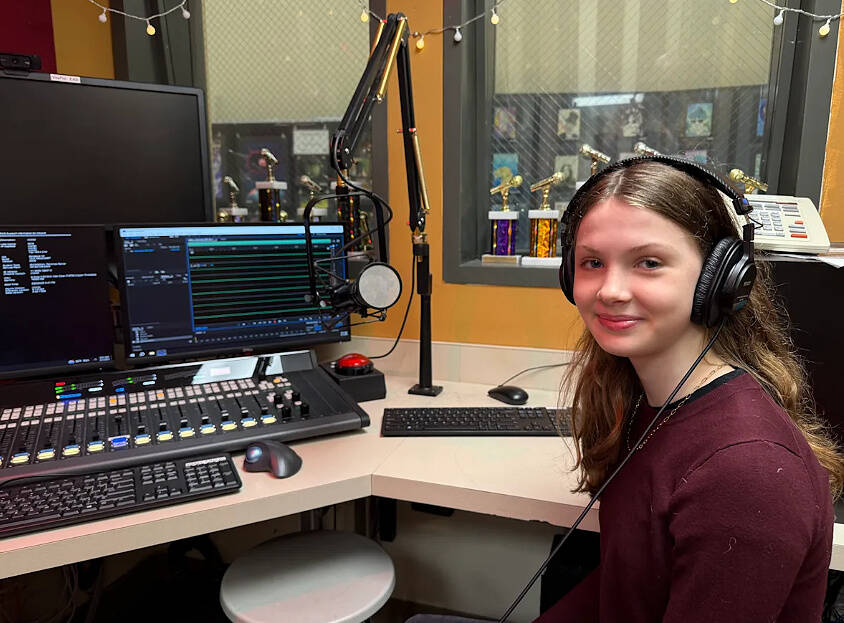 Paloma “Lola” Melian Lafinur sits in the KMIH 88.9 The Bridge studio where she was interviewed about her New York Times Tiny Memoir Contest honorable mention award. She read her memoir, “Mi Nombre,” on both The Bridge and on “The Current” on MIHS.tv. Photo courtesy of the Mercer Island School District