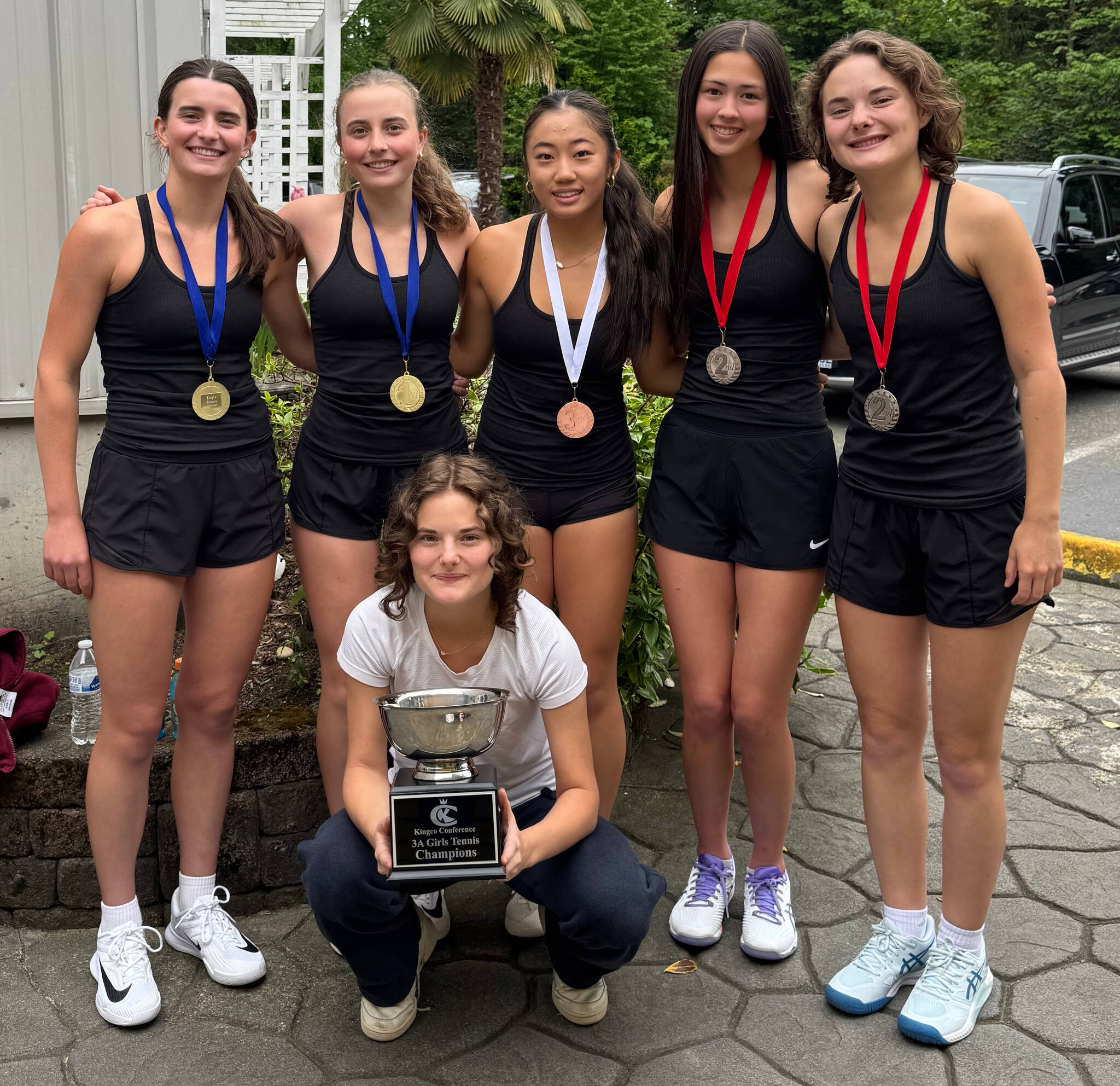 Mercer Island High School tennis players, from left to right: Senior Rachel Garton, sophomore Sarah Garton, freshman Caitlynn Ying, junior Mia Kinney, sophomore Jayne Tintle, and front row with 3A KingCo tournament championship trophy: sophomore Audrey Tintle. Courtesy photo