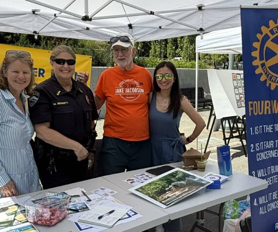 <p>Rotarian Diane Tien, MI Police Chief Michelle Bennett, and Rotarians John Hamer and Linnea Augustine at Rotary’s Summer Celebration table. Courtesy photo.</p>