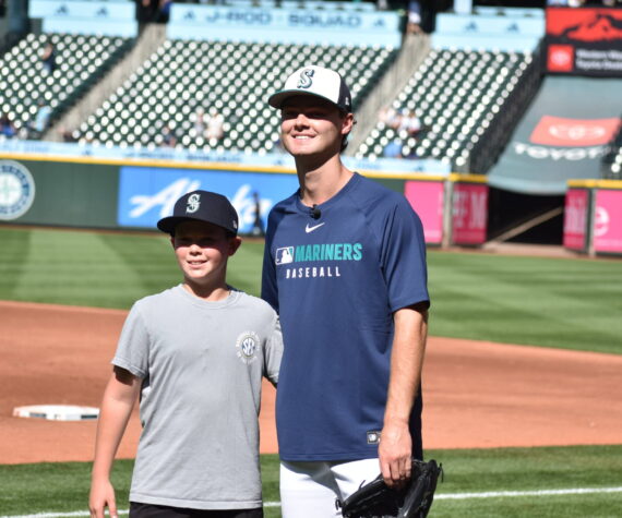 <p>Kade Anderson and his brother Carter during Mariners batting practice. Photo by Ben Ray / Sound Publishing</p>