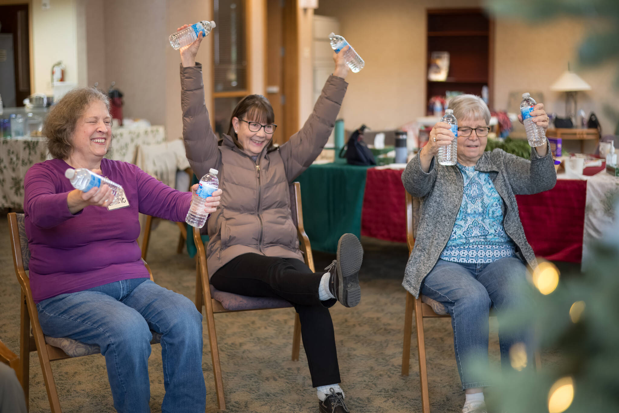 Old Friends Club participants engage in Victorious Water Bottle Weight Training. Photo courtesy of Tanya Su