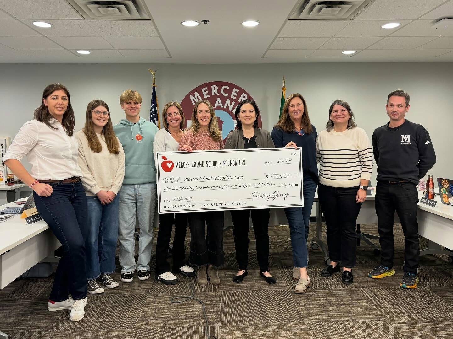 Mercer Island Schools Foundation (MISF) President of the Board of Trustees Mara McCune and Executive Director Tammy Shoop present the board with a check for $952,815.25 to the Mercer Island School District (MISD) on Oct. 9. At the meeting, the board held a recognition for the MISF for its generous contribution. “We so value MISF’s dedication to enhancing and improving the quality of education provided to all MISD students and thank our community for supporting our students, staff, and schools,” MISD said. Photo courtesy of the Mercer Island School District