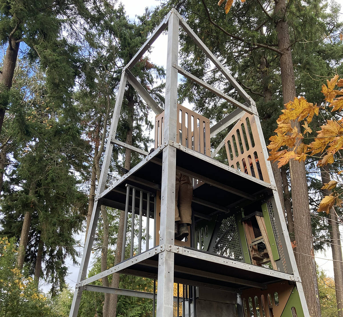 Crews recently began assembling the new Alpha Tower as part of their construction work to install a brand-new playground at First Hill Park. The 20-foot-tall structure, designed for children ages 5-12, features two slides: a double slide for riding two at a time from an eight-foot deck, and a winder slide to ride from a 12-foot deck. Over the past few weeks, crews also poured a concrete slab for the free-play log tunnel; installed posts for new swings; started building a timber curb that will enclose the play area; and began backfilling the enclosure in preparation for an engineered, wood fiber play surfacing. Upcoming work includes pouring a concrete curb at the play area entrance and finishing a timber border. Construction remains on track and is expected to conclude in December. This project is made possible by the parks levy renewal approved by Mercer Island voters in 2022. Photo courtesy of the city of Mercer Island