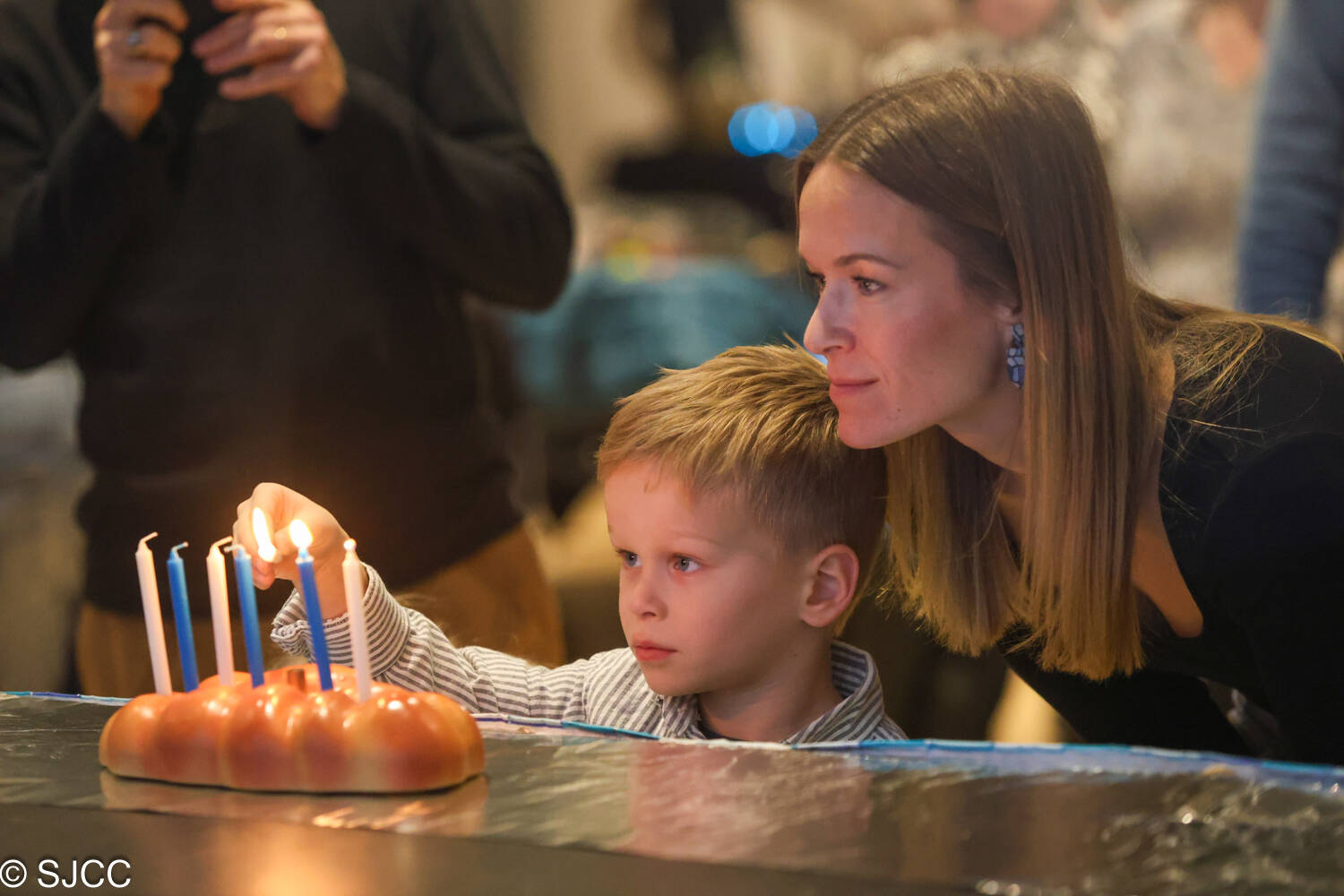 The Stroum Jewish Community Center (SJCC) on Mercer Island held its Family Hanukkah Dinner and Celebration on Dec. 19. Attendees enjoyed a festive evening with traditional treats, candle making, dreidels and an indoor Little Jumper bouncy house for kids 5 and under. The night included a pizza and salad dinner, a latke and sufganiyot station, and two drink tickets for each adult over 21. Photo courtesy of the SJCC