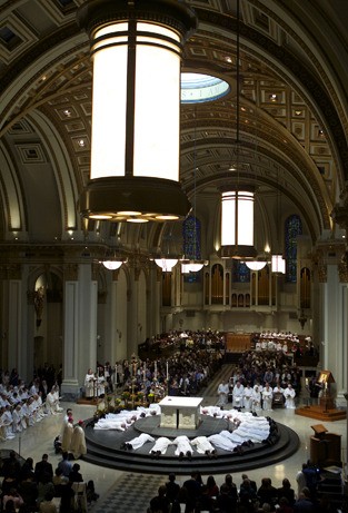 Islander Frank DiGirolamo lies on the altar at St. James Cathedral in Seattle