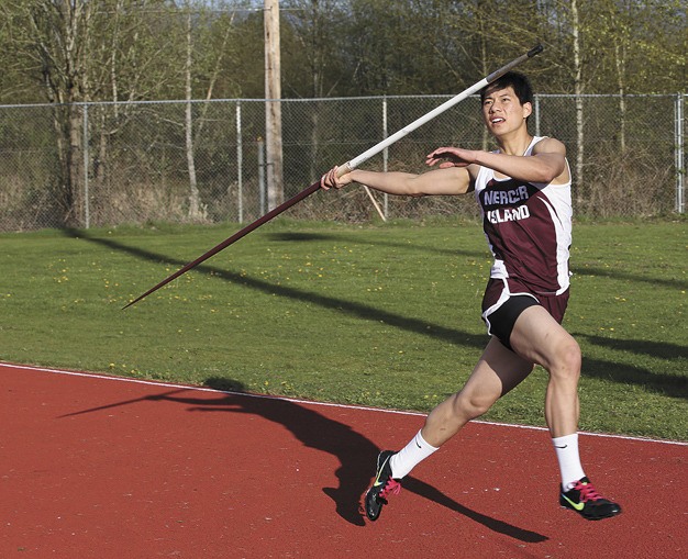 Mercer Island senior Ken Ng tosses the javelin during the Islanders’ away meet at Juanita last Thursday. He finished second to teammate Peter Brockway with a throw of 143 feet and 10 inches.