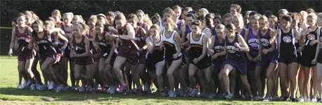 Members of the Mercer Island girls cross country team take off from the starting line during last Wednesday’s home meet against Garfield