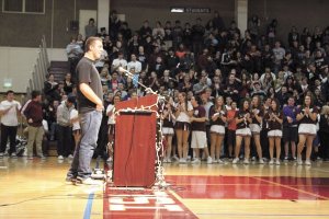 Mercer Island High School students give senior Jeff Lindquist a standing ovation during the MIHS winter sports assembly on Dec. 2. Lindquist was given his jersey to wear during the Semper Fidelis Bowl in January.