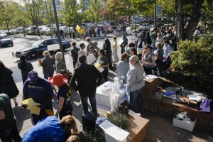 Protestors gathered on the corner of 78th Ave. S.E. and S.E. 28th Street Thursday morning near Rep. Dave Reichert's office. Protestors hosted a Depression-era unemployment line