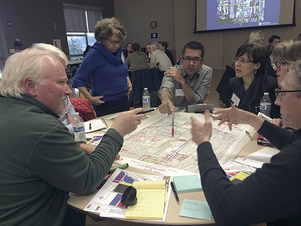 A group of Town Center stakeholders discusses how the city should regulate downtown development to get the green spaces