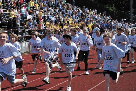 Runners in the West Mercer 800-meter race take off down the start line at last Friday's All Island Track meet. Lakeridge won the spirit award