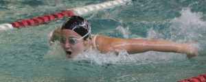 Margaret Seaton propels herself through the water during the 100 yard butterfly race on Thursday afternoon at Mary Wayte Pool against Interlake.