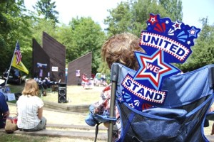A woman shows U.S. pride while listening to blogger ‘Liberty Belle