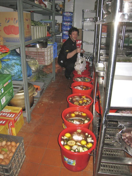 Our family skipped the hassle of finding traditional American ingredients and the inefficiencies of using a Chinese gas oven by having our feast catered by Sequoia Cafe. Canadian chef Billy Kawaja shows off all the brining turkeys.