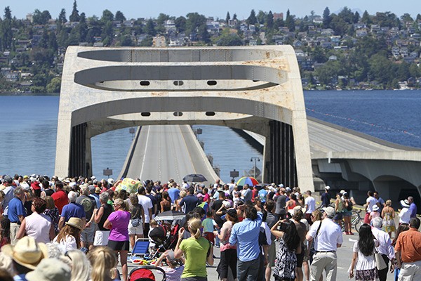 People crowd on the I-90 bridge to watch the U.S. Navy Blue Angels during Seafair.