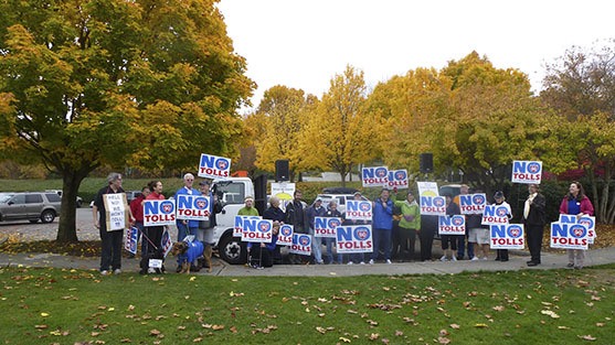 Dozens came to a rally against tolling I-90 at Aubrey Davis Park Oct. 26.