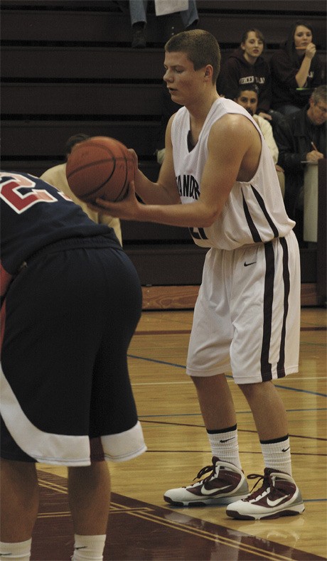 Parker Scott mentally prepares for his shot at the foul line during the Islanders home win last week over Juanita. Scott had five points in the 57-44 win.