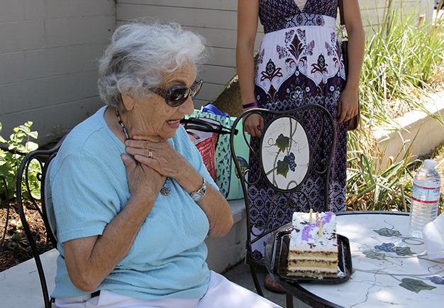 Mercer Islander Priscilla Drebin blows out the candles on her 90th birthday cake on Aug. 20.