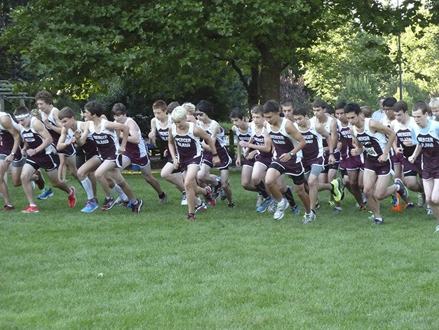 The Mercer Island boys cross country team takes off at a dual meet with Sammamish in Robinswood Park on Sept. 18.