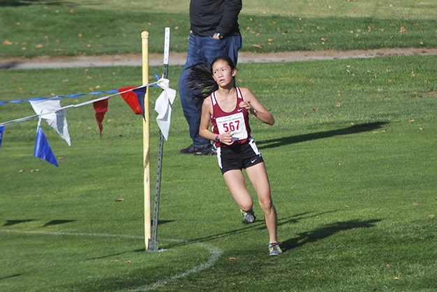 Mary Rose Vu rounds the bend during the girls 5K race at the 3A state cross country championships Saturday