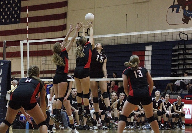 Mercer Island’s Olivia Hughes (15) goes up to joust against Ballard’s front line during the first round of the Sea-King 3A district tournament Thursday